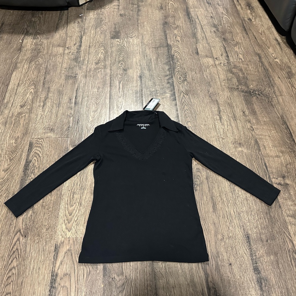 Women's size extra small, brand new, Geoffrey Beene Sport long sleeved black top